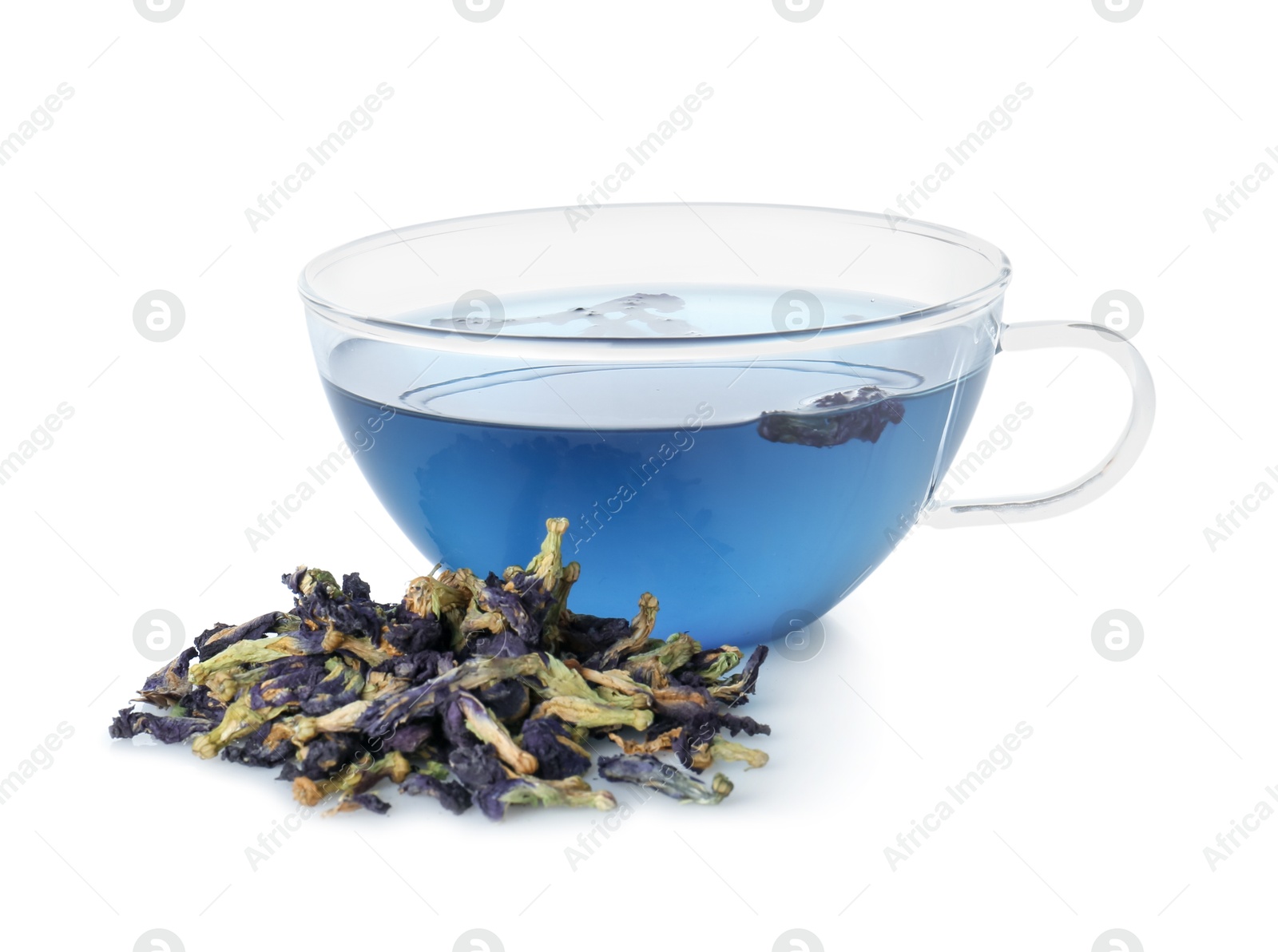 Photo of Delicious butterfly pea flower tea in glass cup and dry petals isolated on white