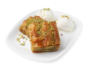 Photo of Delicious baklava with crushed nuts and ice cream isolated on white