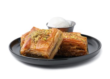 Photo of Delicious baklava with crushed nuts and ice cream isolated on white