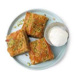 Photo of Delicious baklava with crushed nuts and ice cream isolated on white, top view