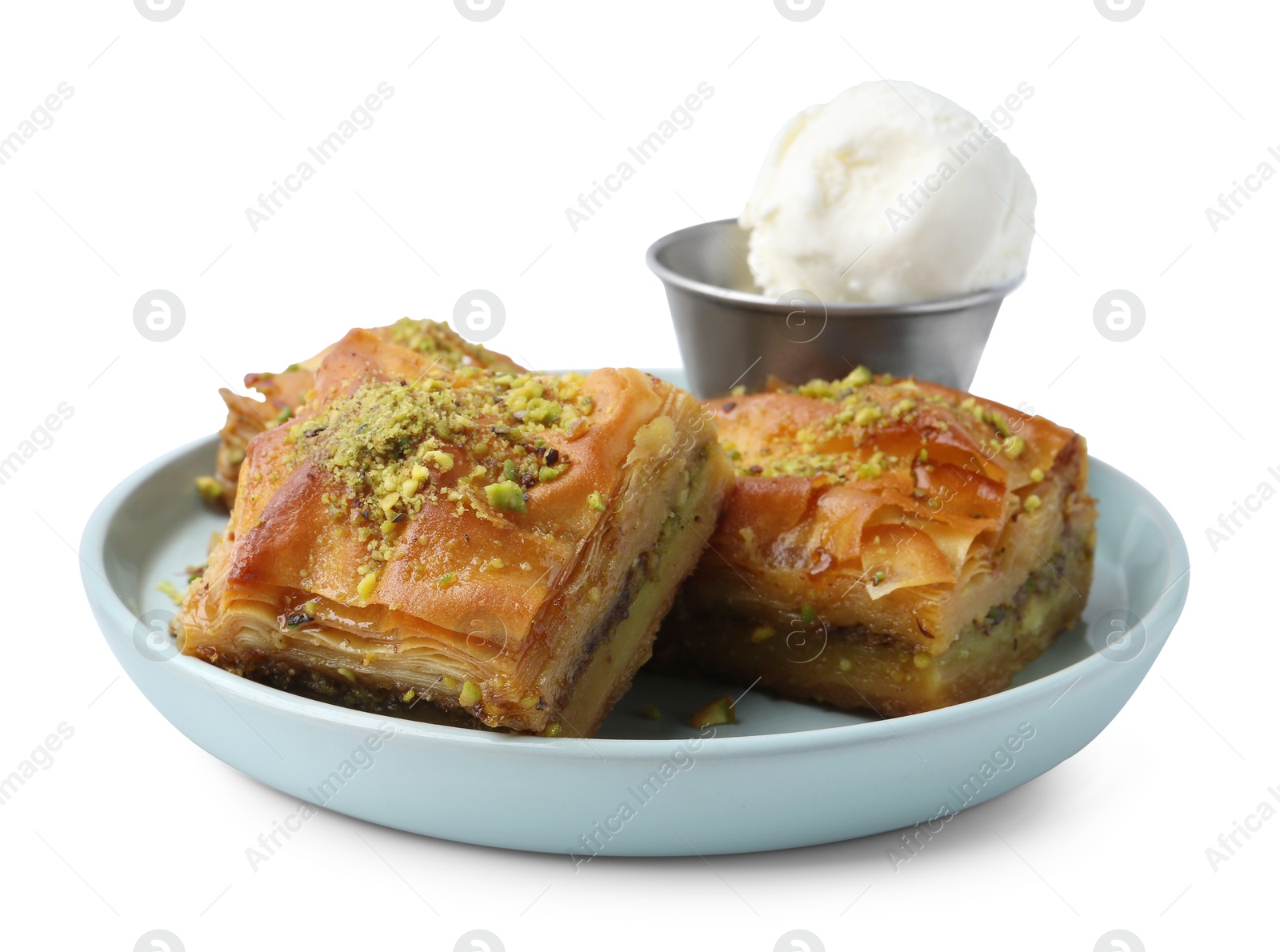 Photo of Delicious baklava with crushed nuts and ice cream isolated on white