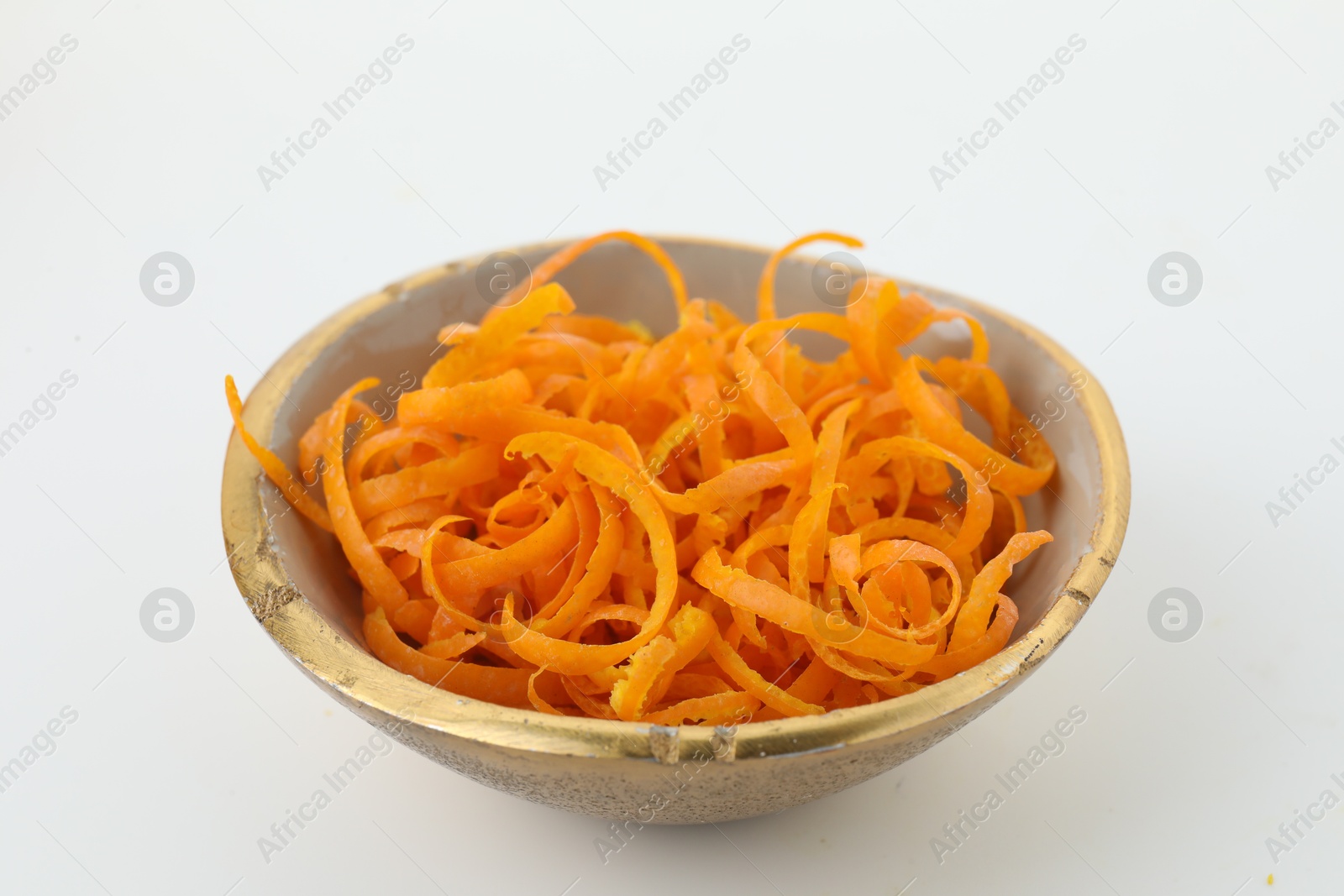 Photo of Fresh orange zest in bowl on white background, closeup