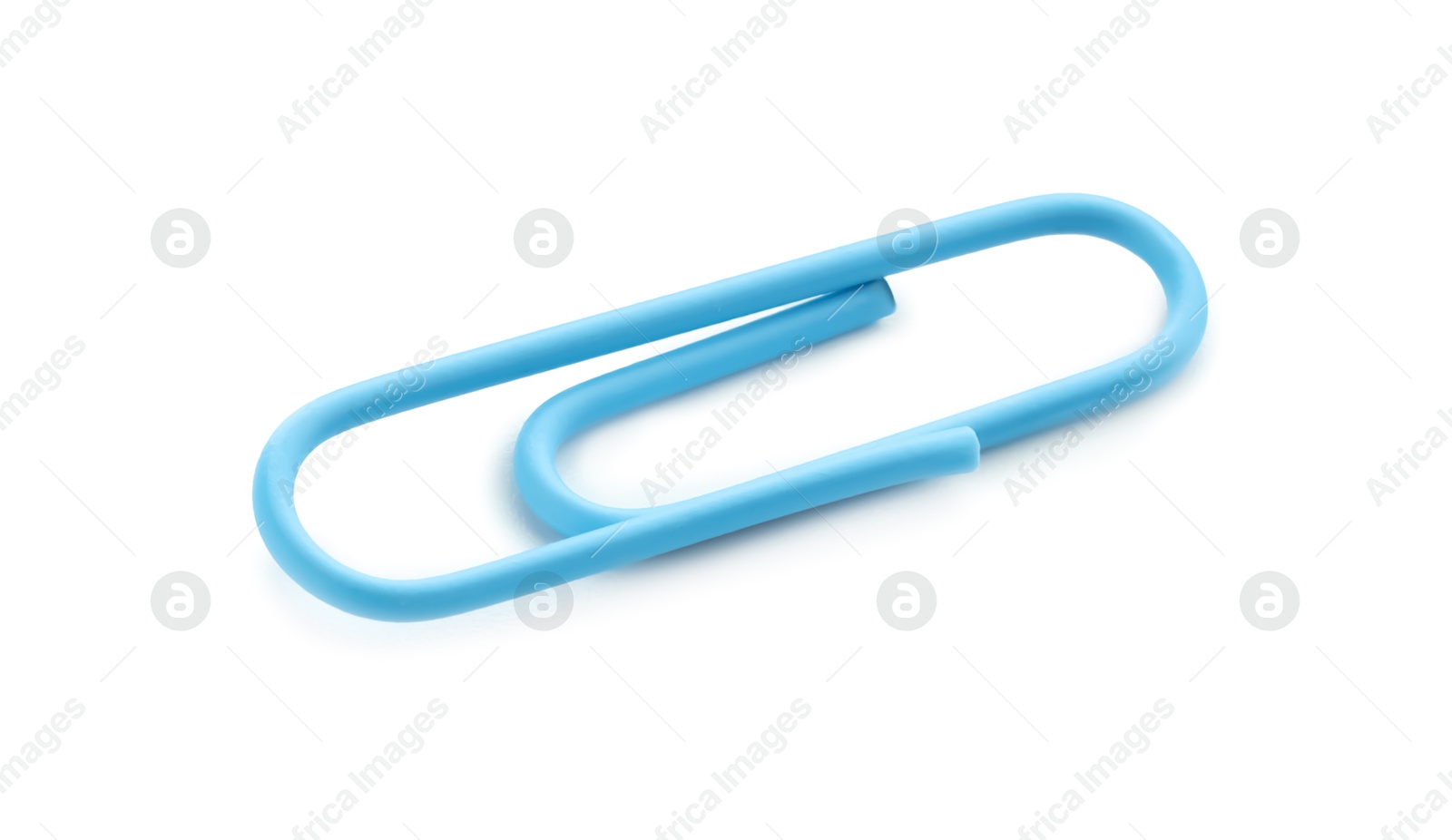 Photo of One bright paper clip isolated on white