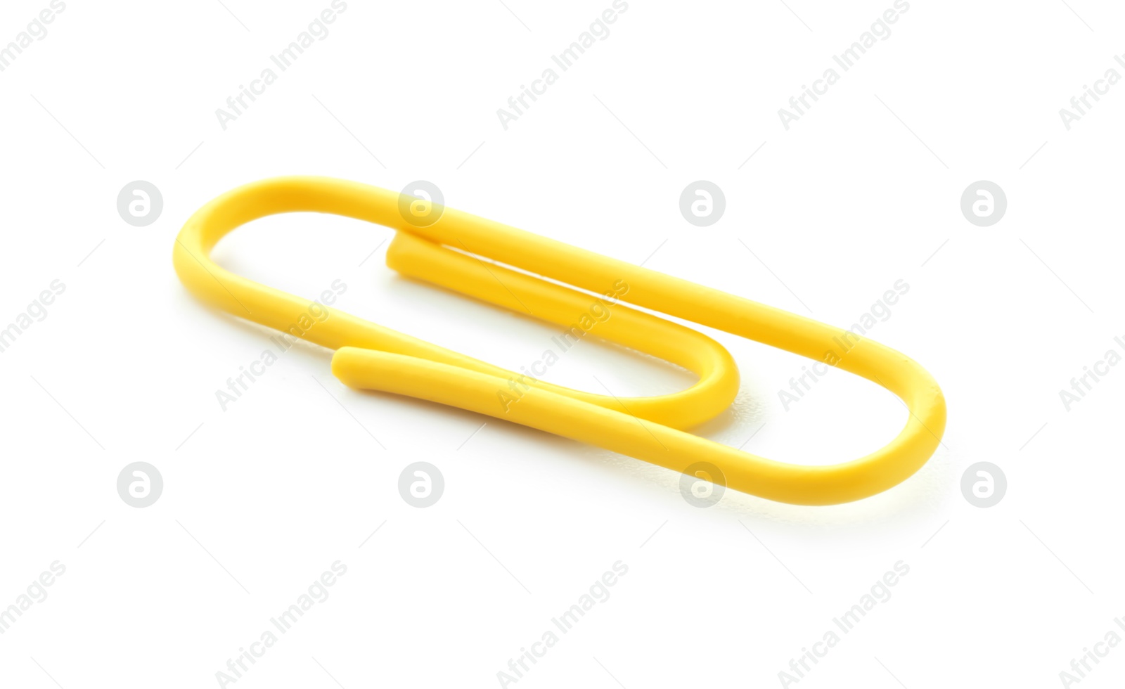 Photo of One bright paper clip isolated on white