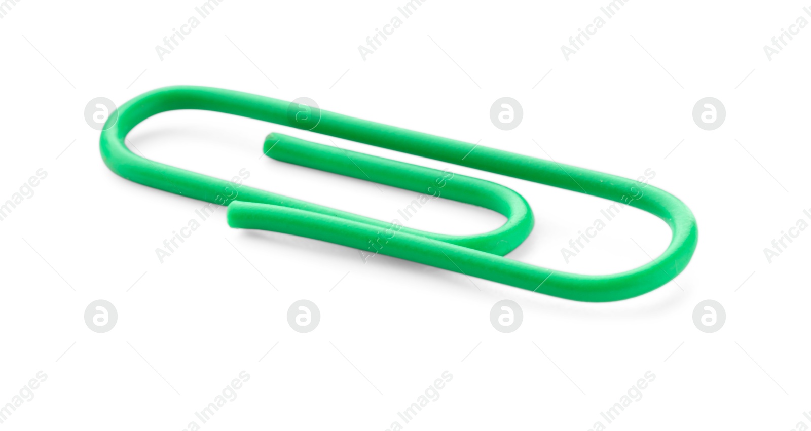 Photo of One bright paper clip isolated on white