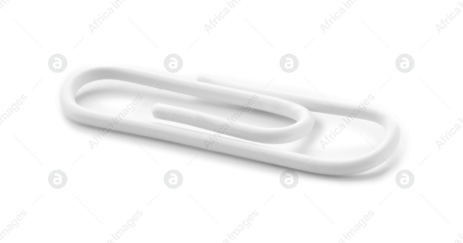 Photo of One new paper clip isolated on white