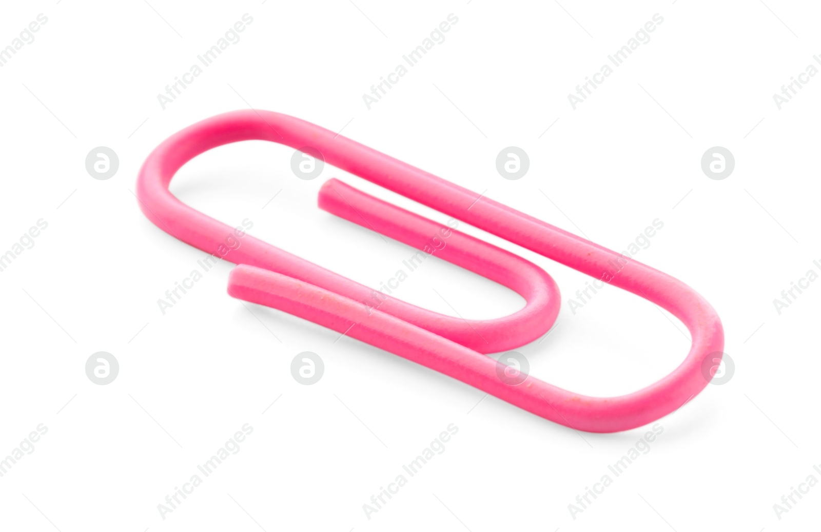 Photo of One bright paper clip isolated on white