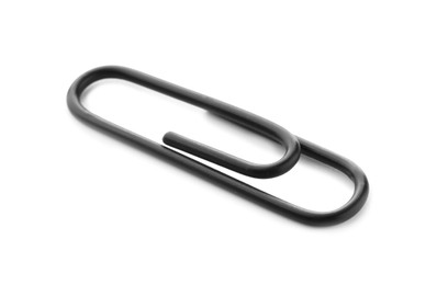 Photo of One black paper clip isolated on white