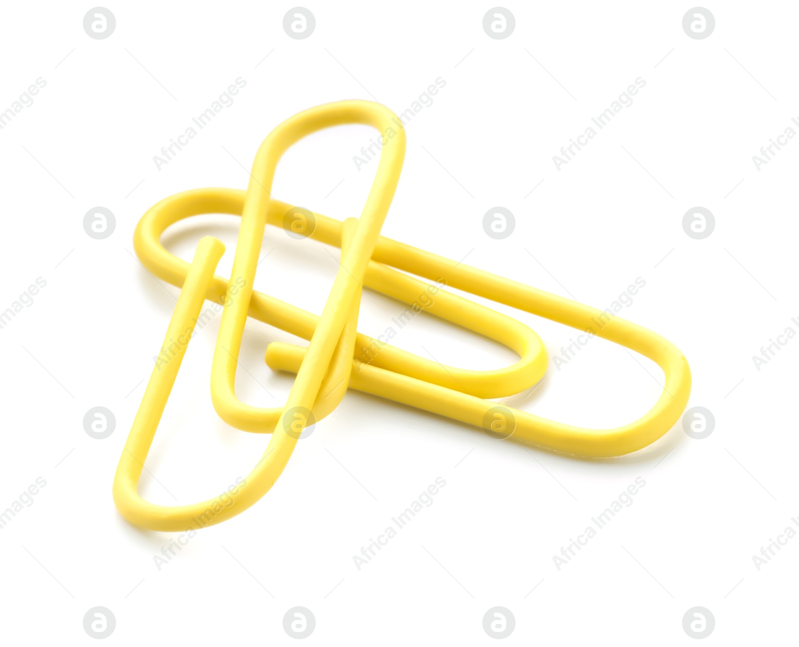 Photo of Two bright paper clips isolated on white