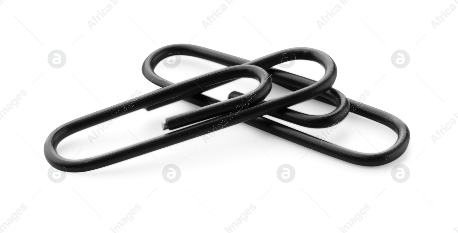 Photo of Two black paper clips isolated on white