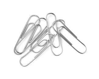 Photo of Many metal paper clips isolated on white, top view