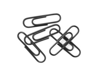 Photo of Black paper clips isolated on white, top view