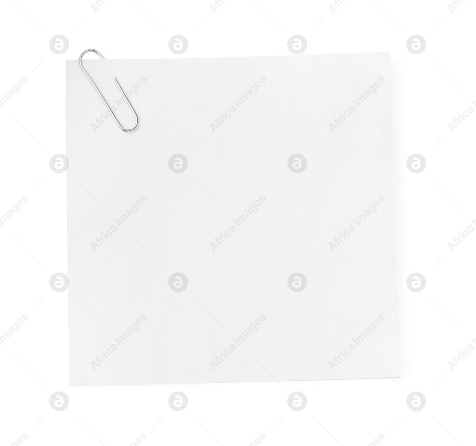 Photo of Blank paper note attached with metal clip isolated on white, top view