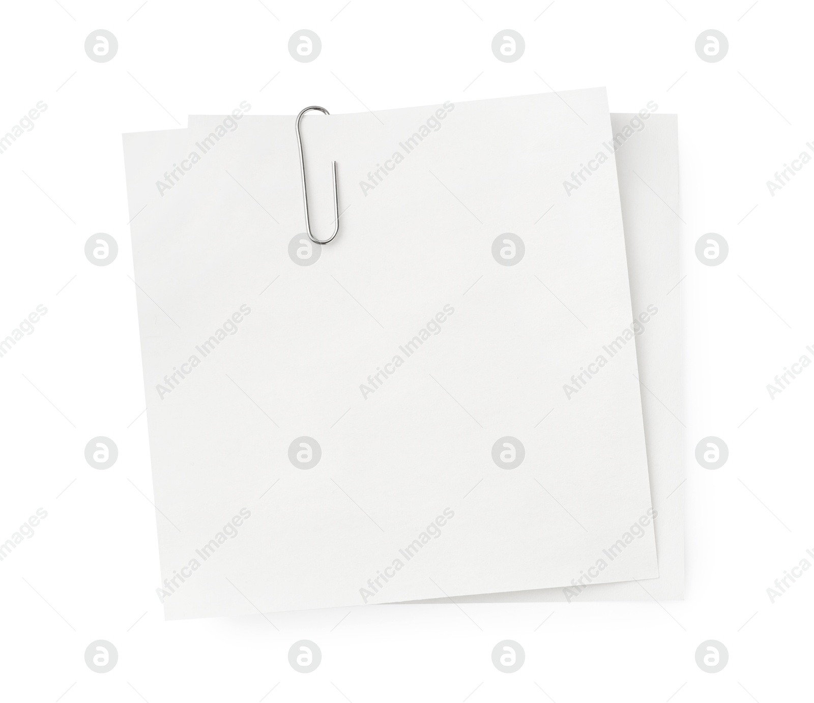 Photo of Blank paper notes attached with metal clip isolated on white, top view