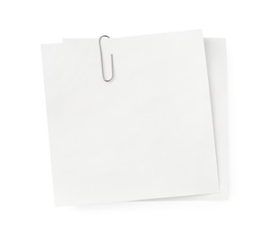 Photo of Blank paper notes attached with metal clip isolated on white, top view