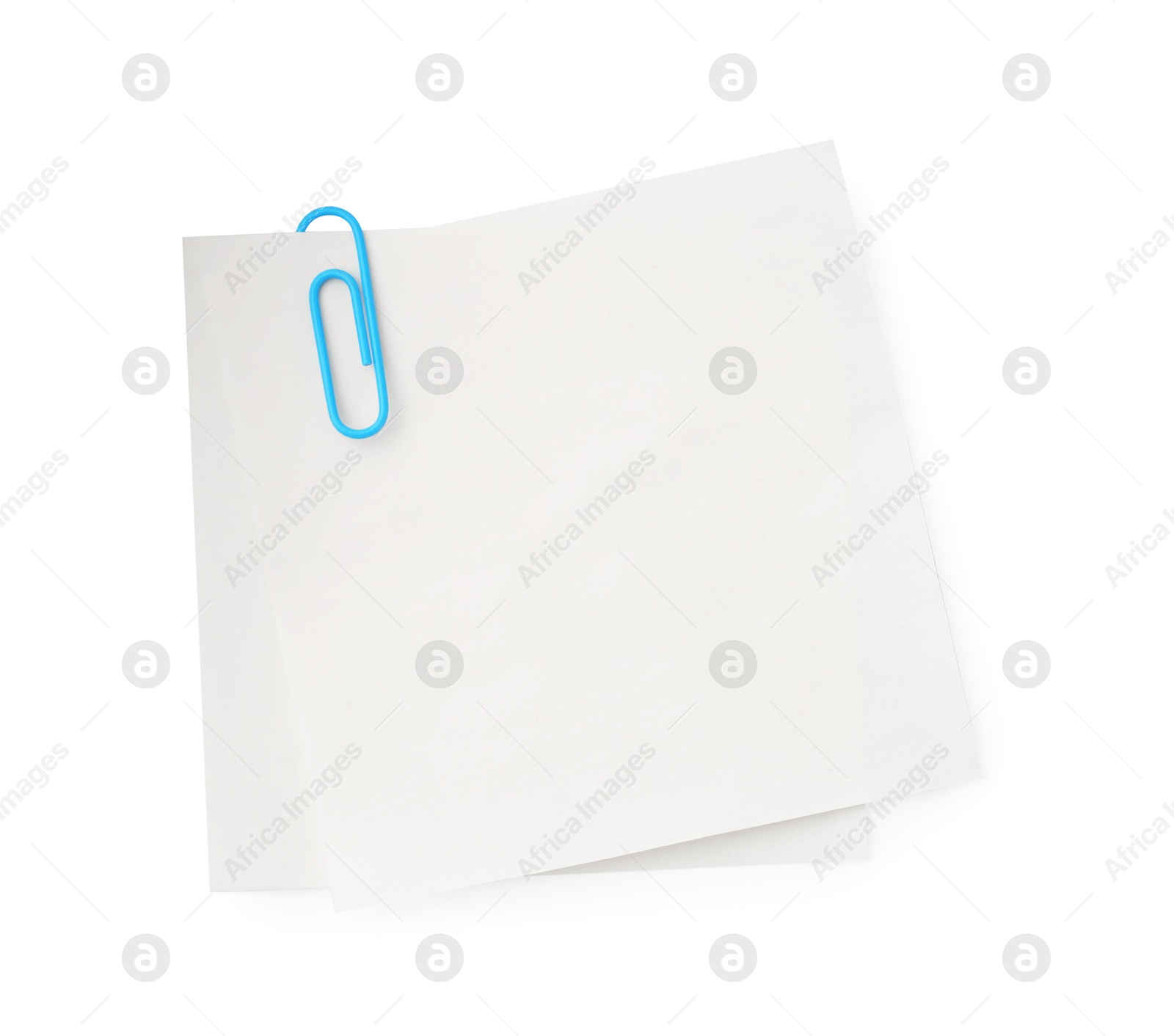 Photo of Blank paper notes attached with clip isolated on white, top view