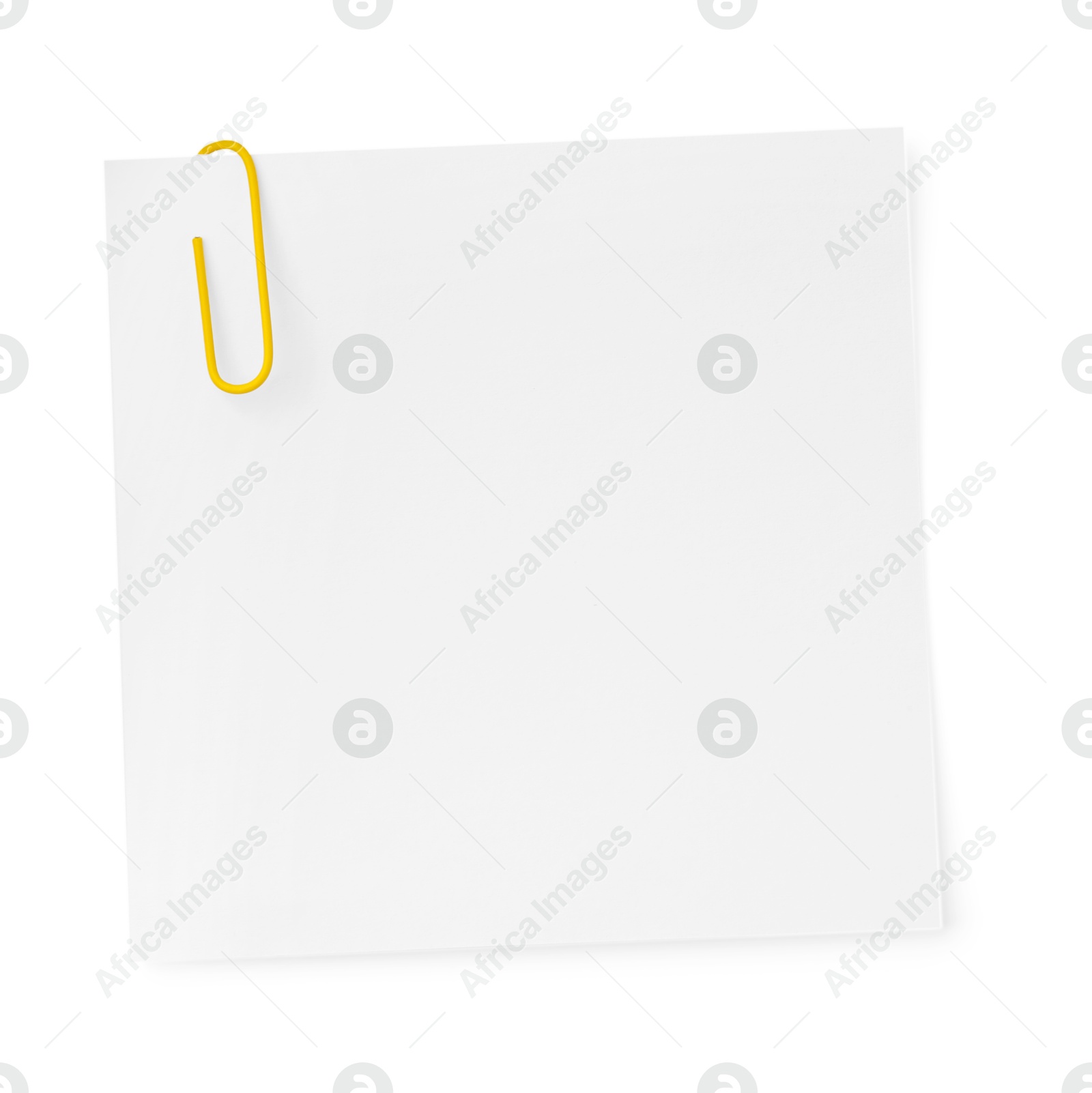 Photo of Blank paper note attached with clip isolated on white, top view