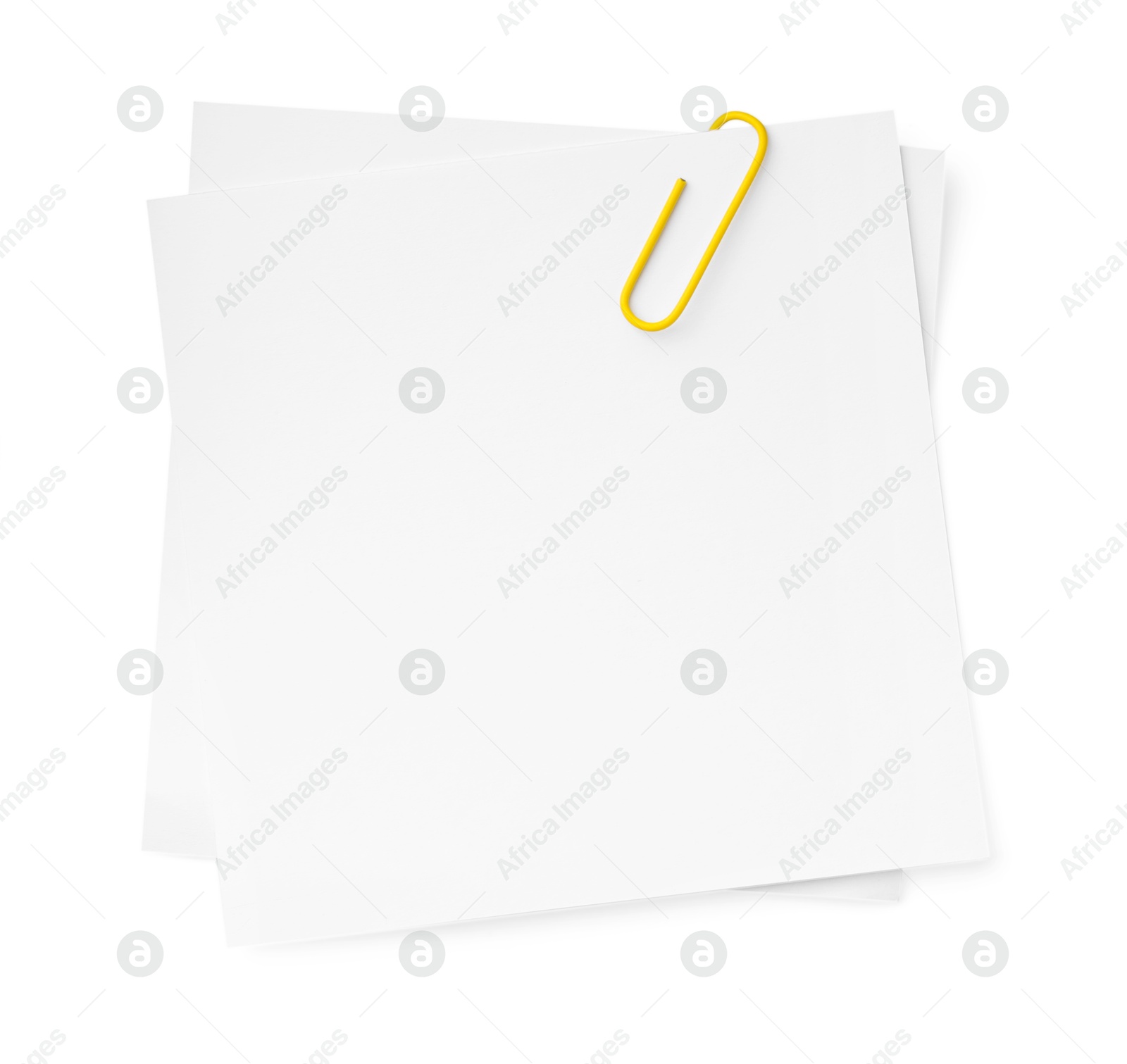 Photo of Blank paper notes attached with clip isolated on white, top view