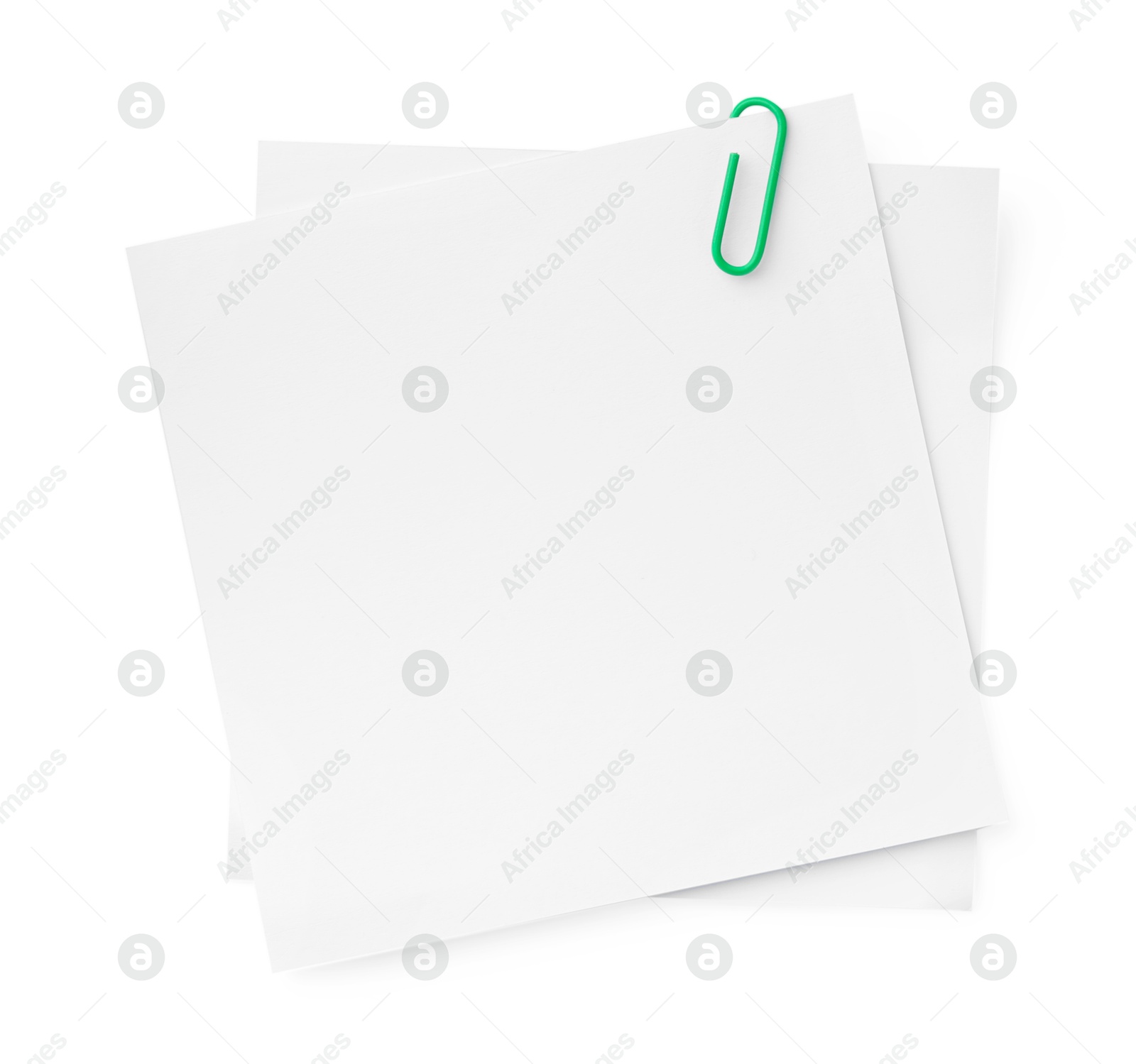 Photo of Blank paper notes attached with clip isolated on white, top view