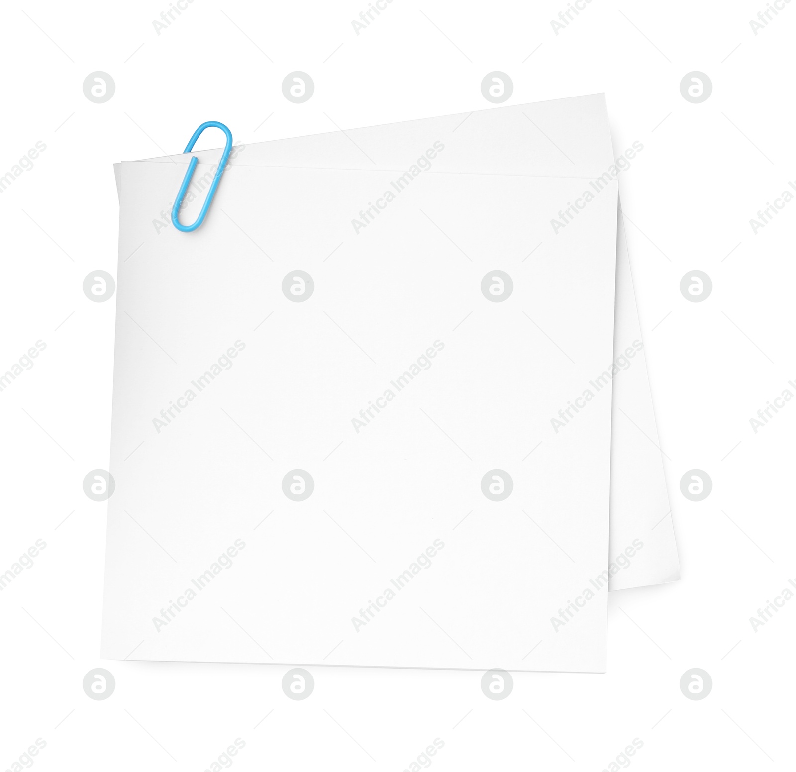 Photo of Blank paper notes attached with clip isolated on white, top view