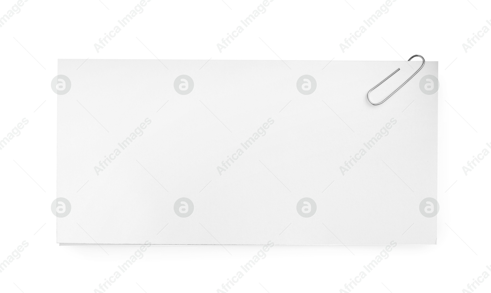 Photo of Blank paper sheet attached with clip isolated on white, top view