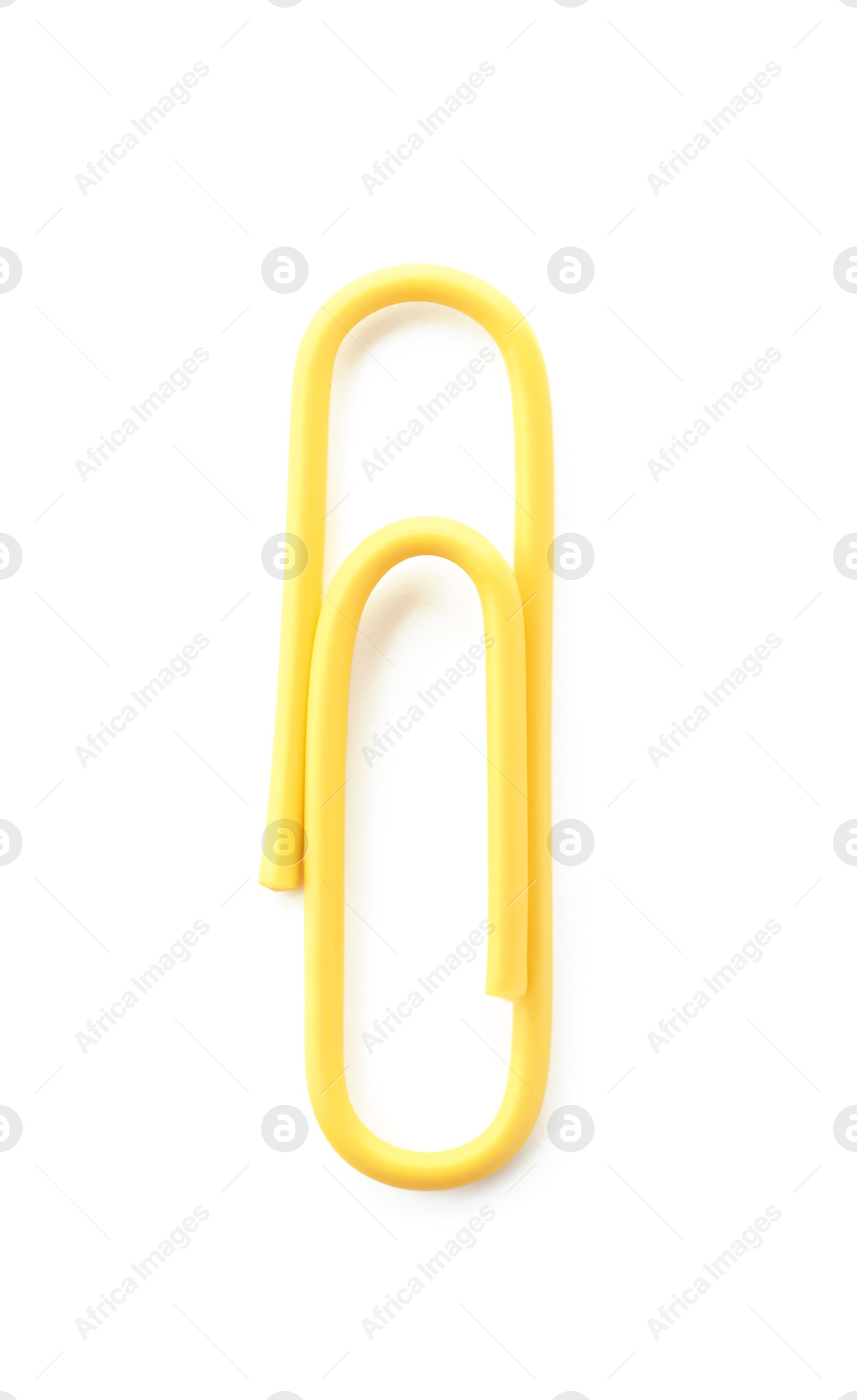 Photo of One bright paper clip isolated on white, top view