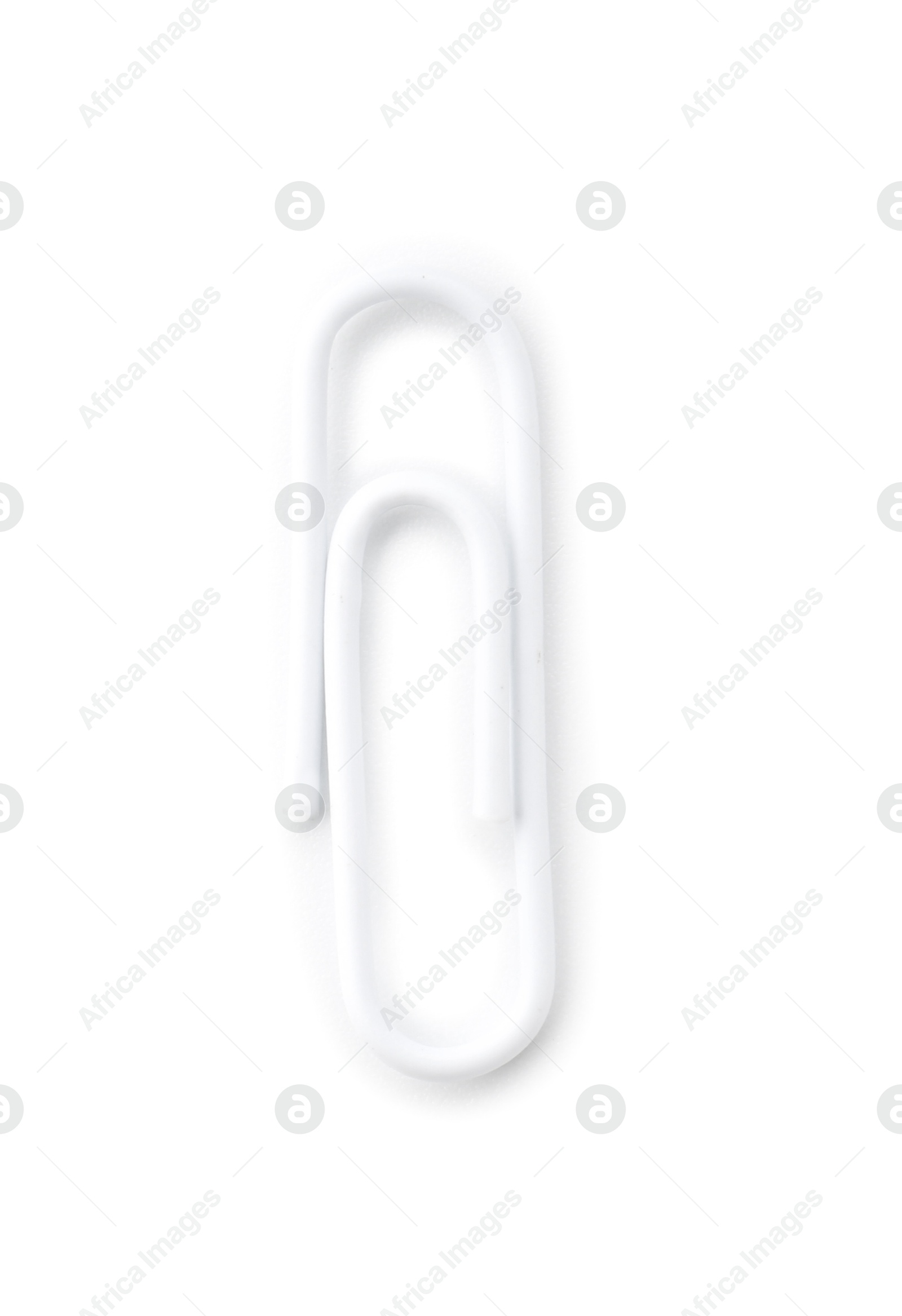 Photo of One paper clip isolated on white, top view