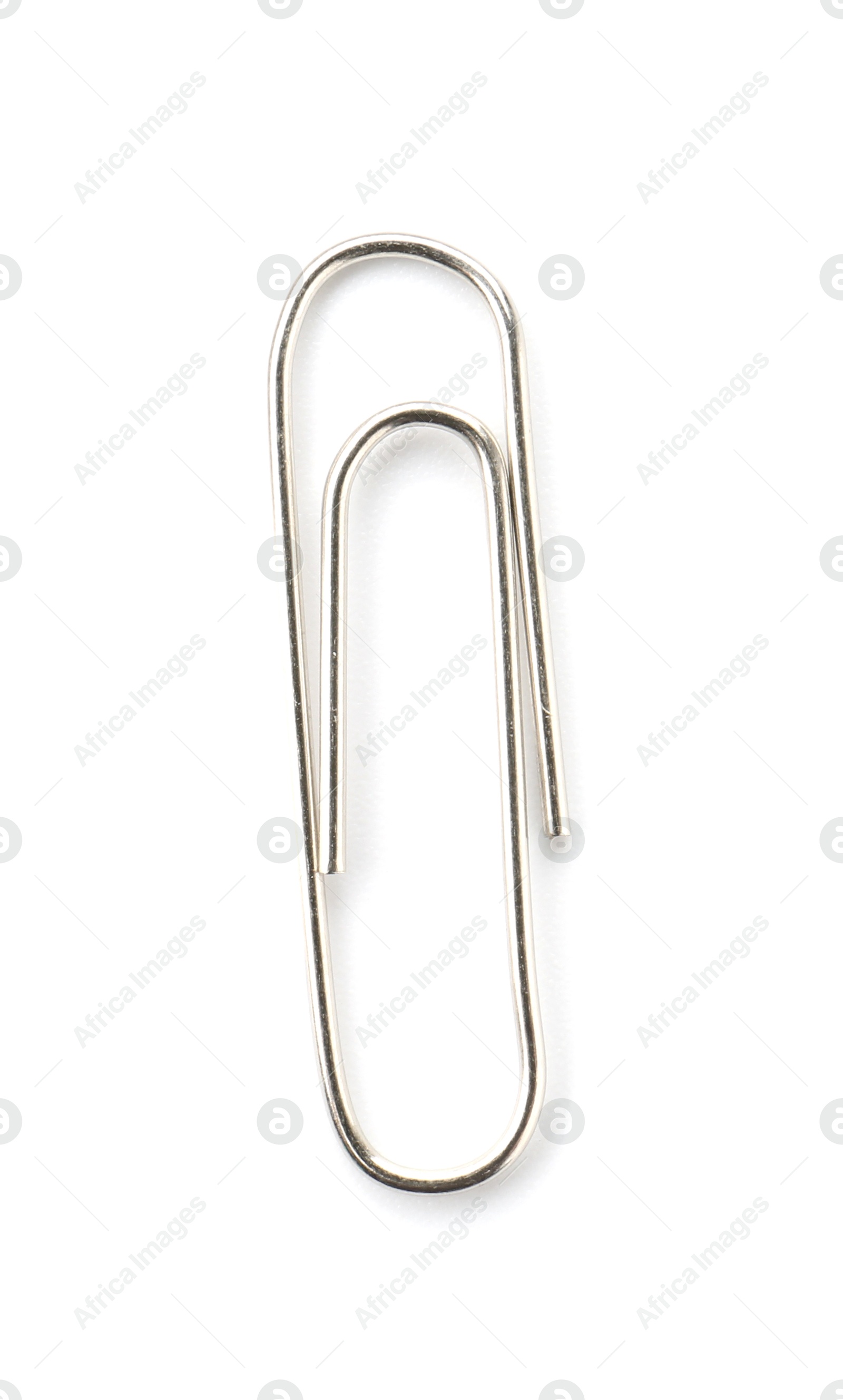 Photo of One metal paper clip isolated on white, top view