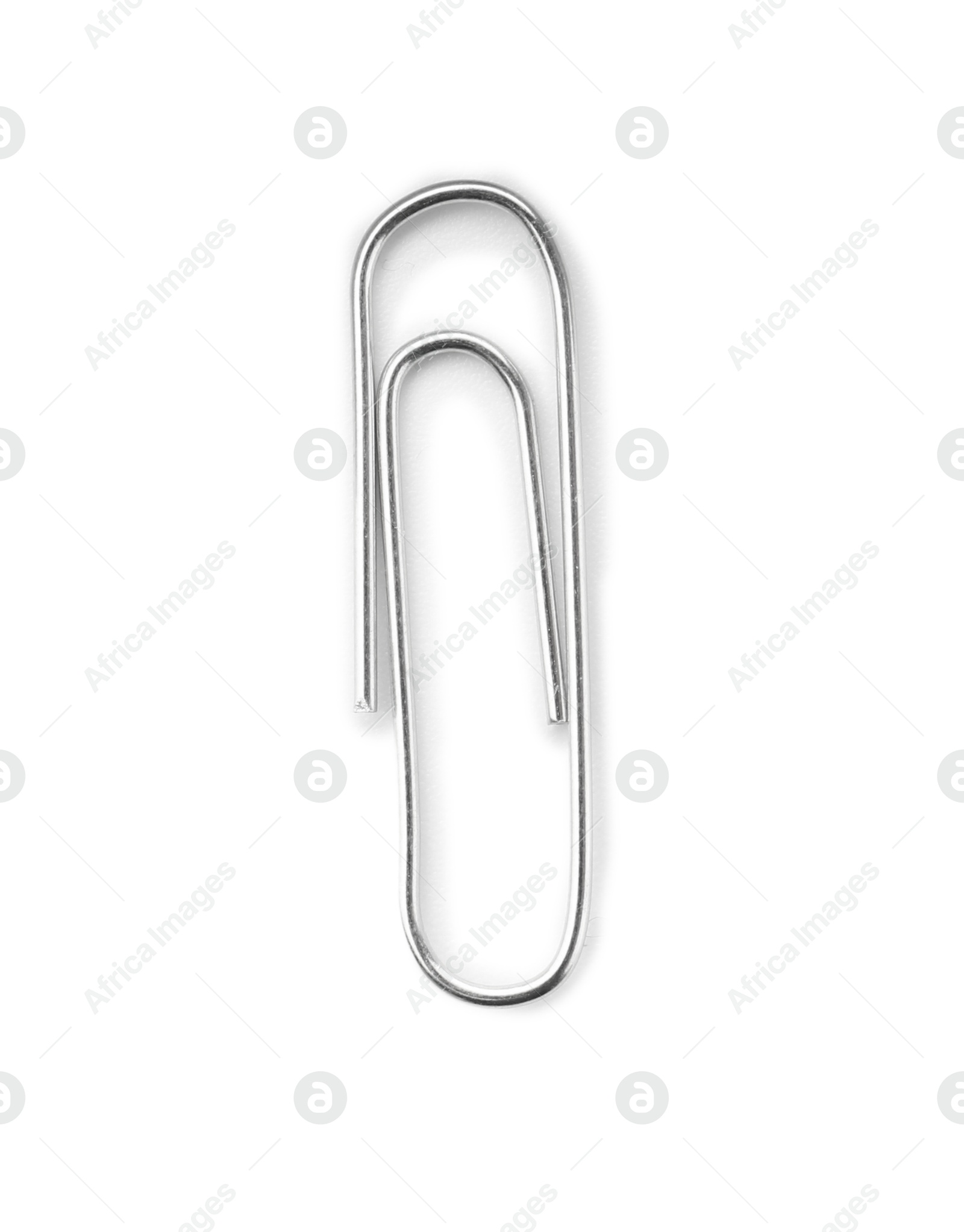 Photo of One metal paper clip isolated on white, top view