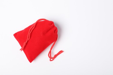 Photo of One red burlap sack on white background, top view