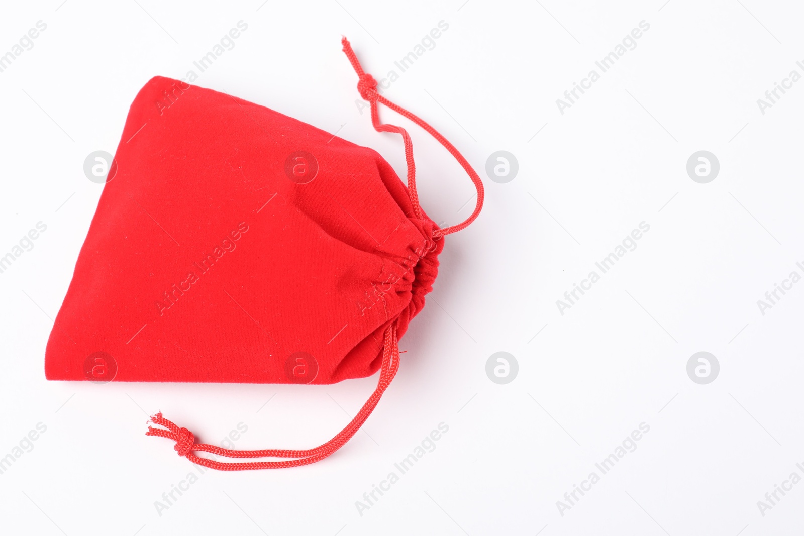 Photo of One red burlap sack on white background, top view