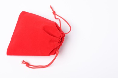 Photo of One red burlap sack on white background, top view