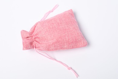 Photo of One pink burlap sack on white background, top view