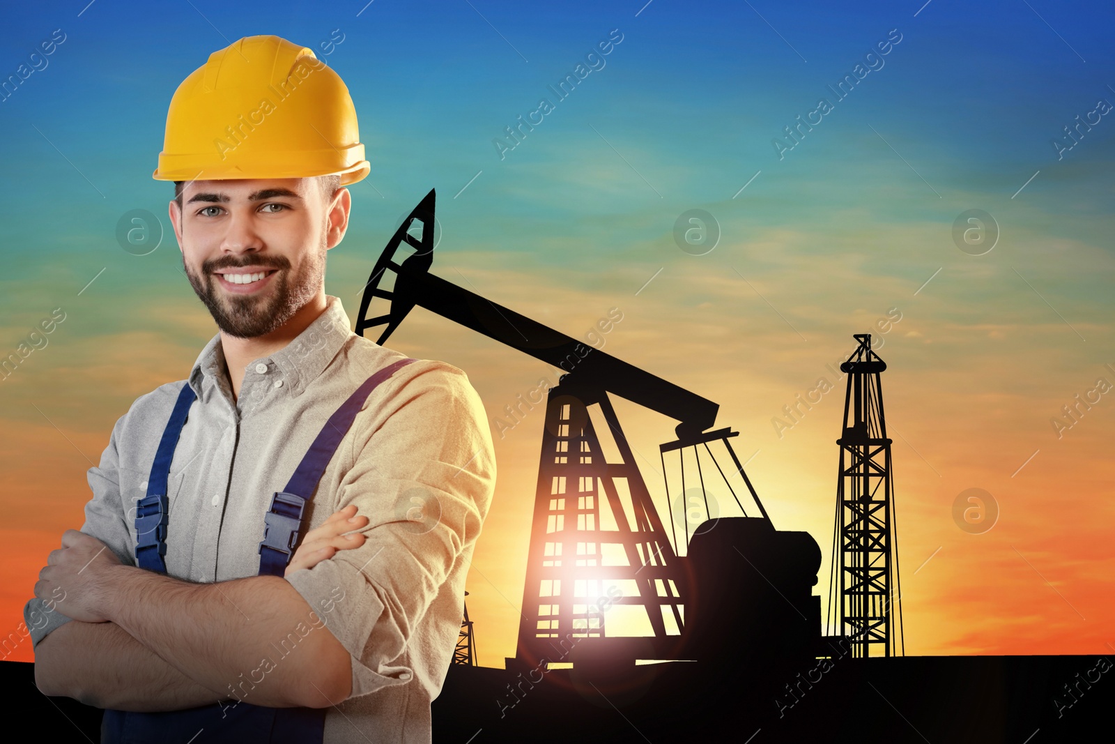 Image of Worker at oil production site with crude oil pump