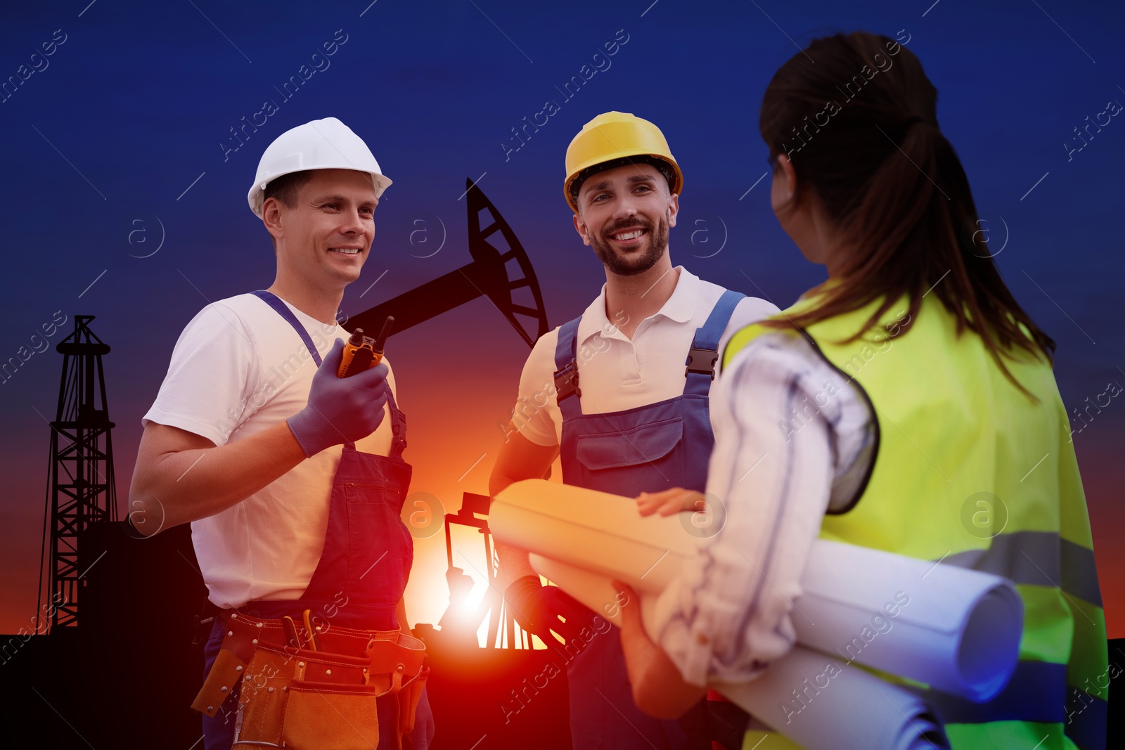 Image of Workers at oil production site with crude oil pumps