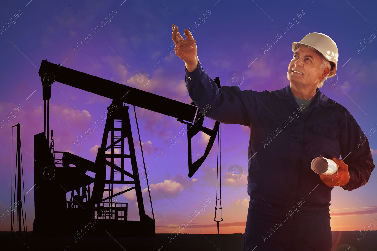 Image of Worker at oil production site with crude oil pump