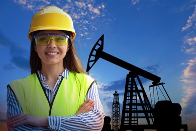 Worker at oil production site with crude oil pump