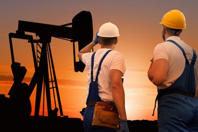 Workers at oil production site with crude oil pump