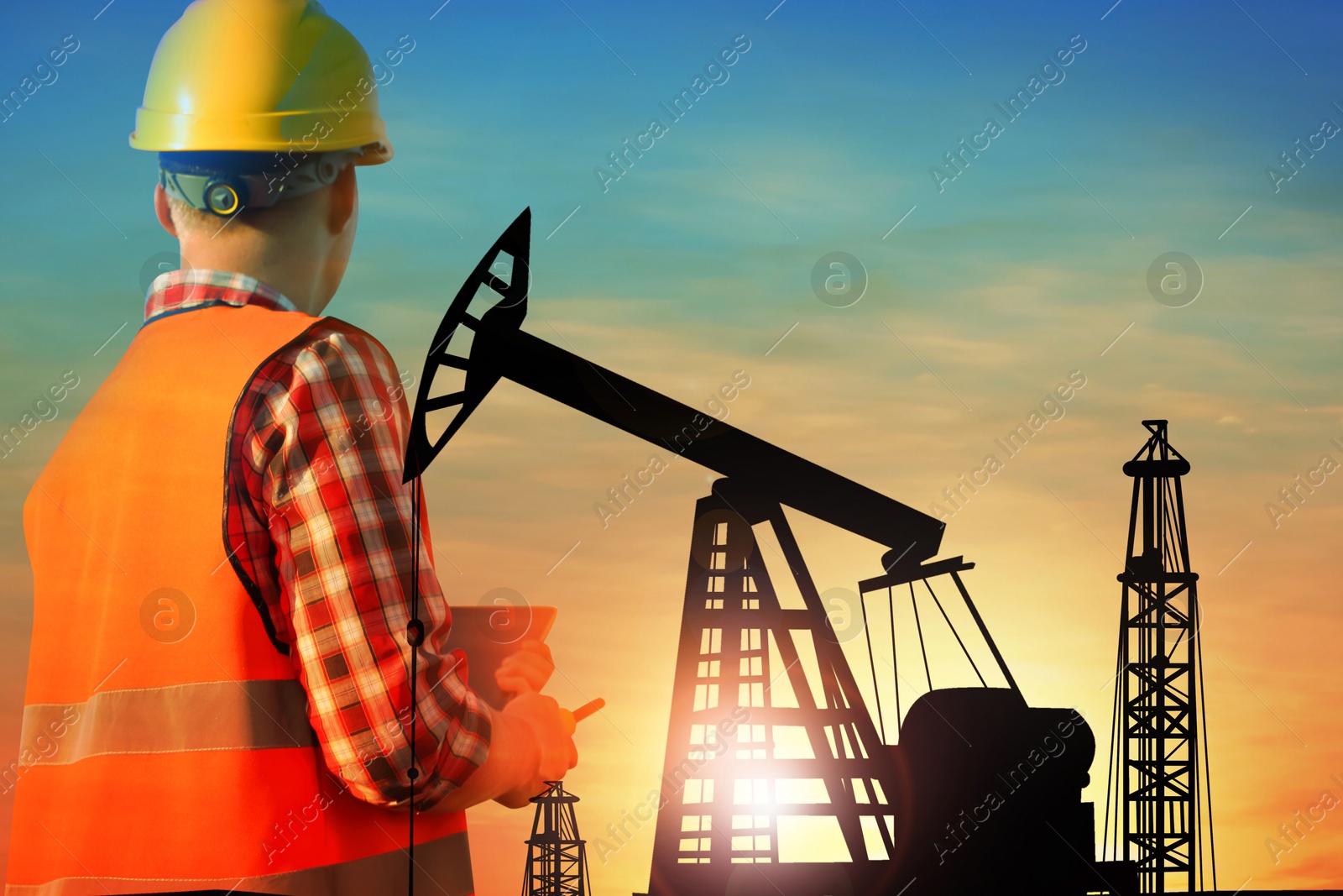 Image of Worker, double exposure with crude oil pump