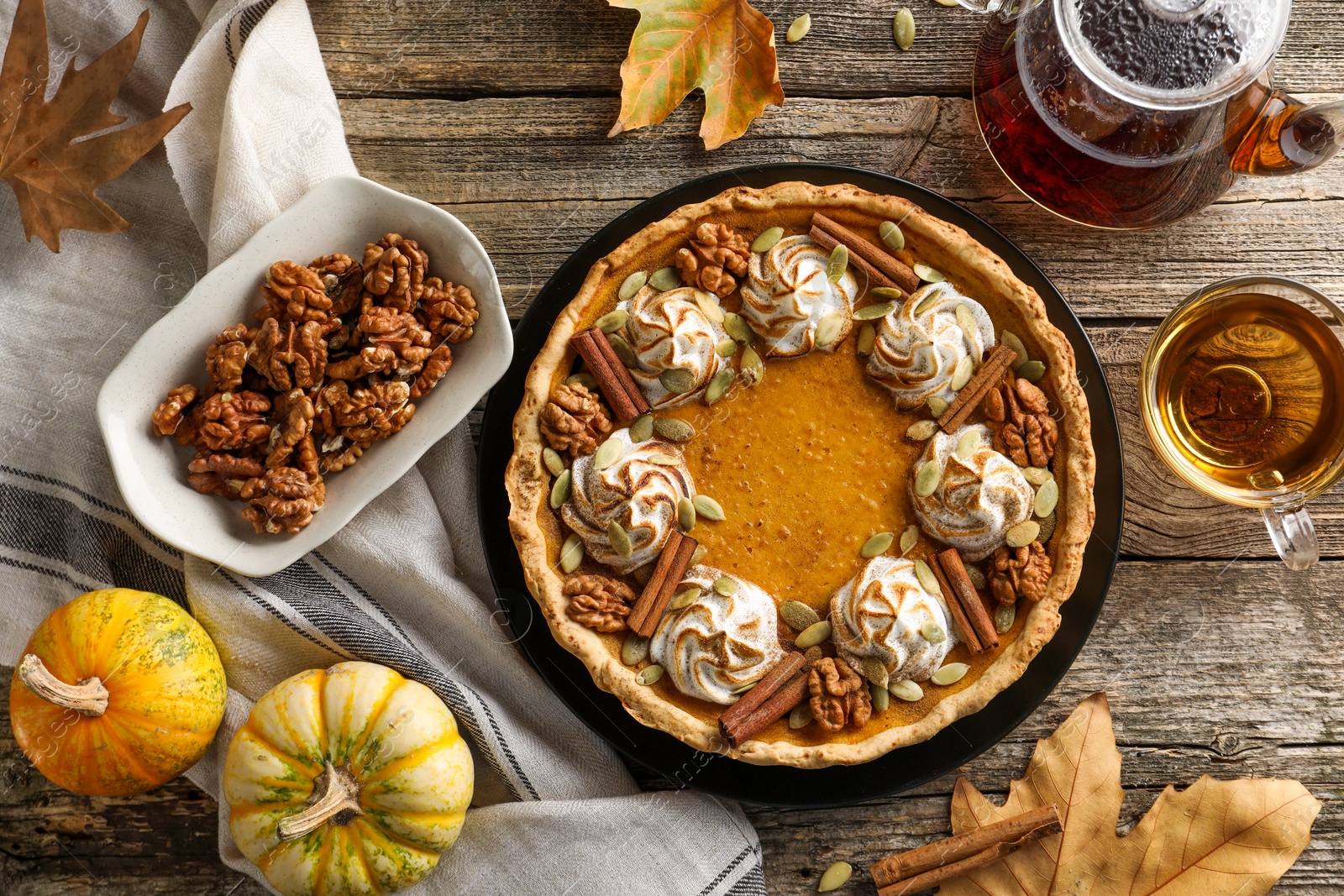 Photo of Flat lay composition with homemade pumpkin pie on wooden table