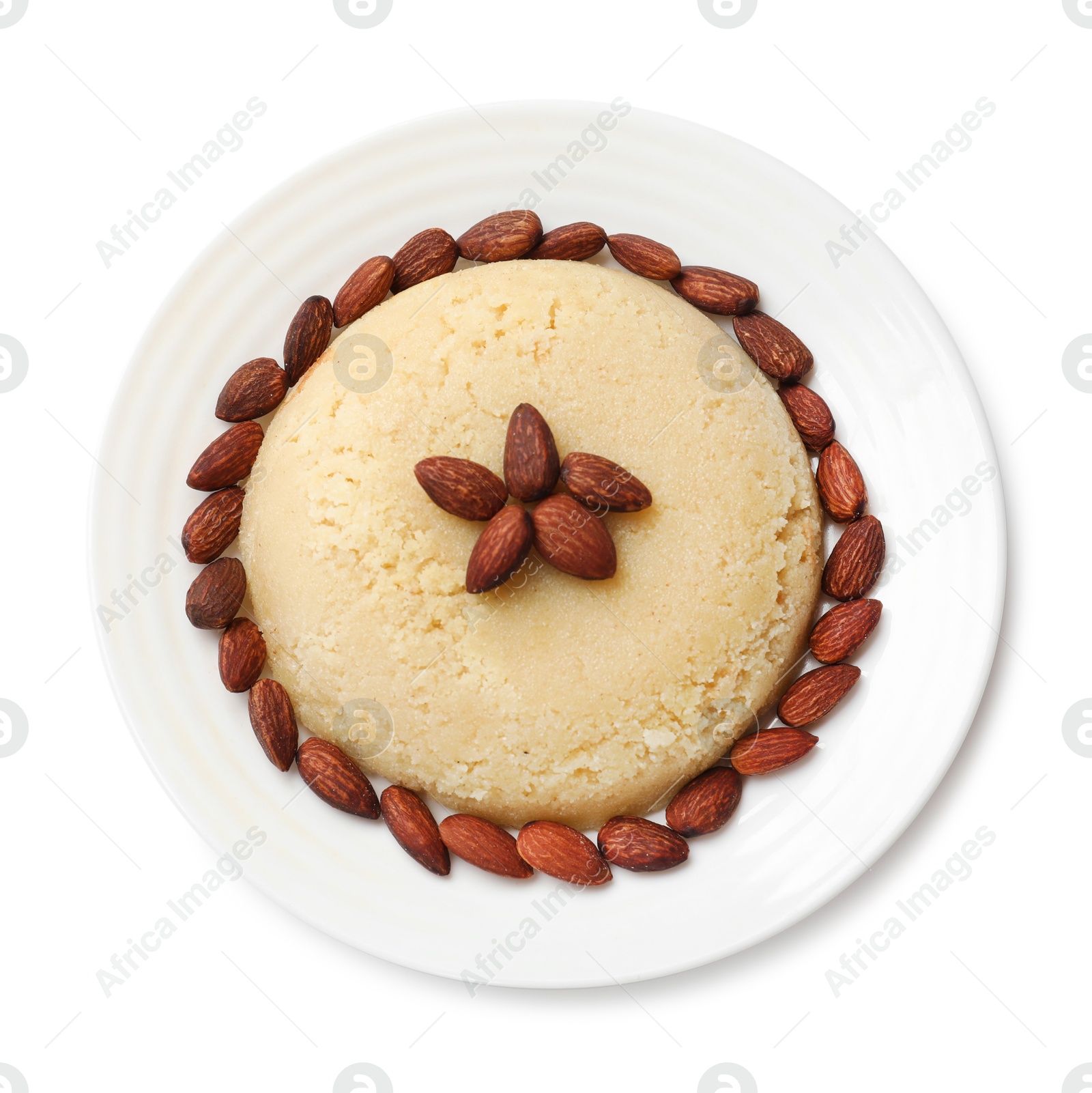 Photo of Delicious semolina halva with almonds isolated on white, top view