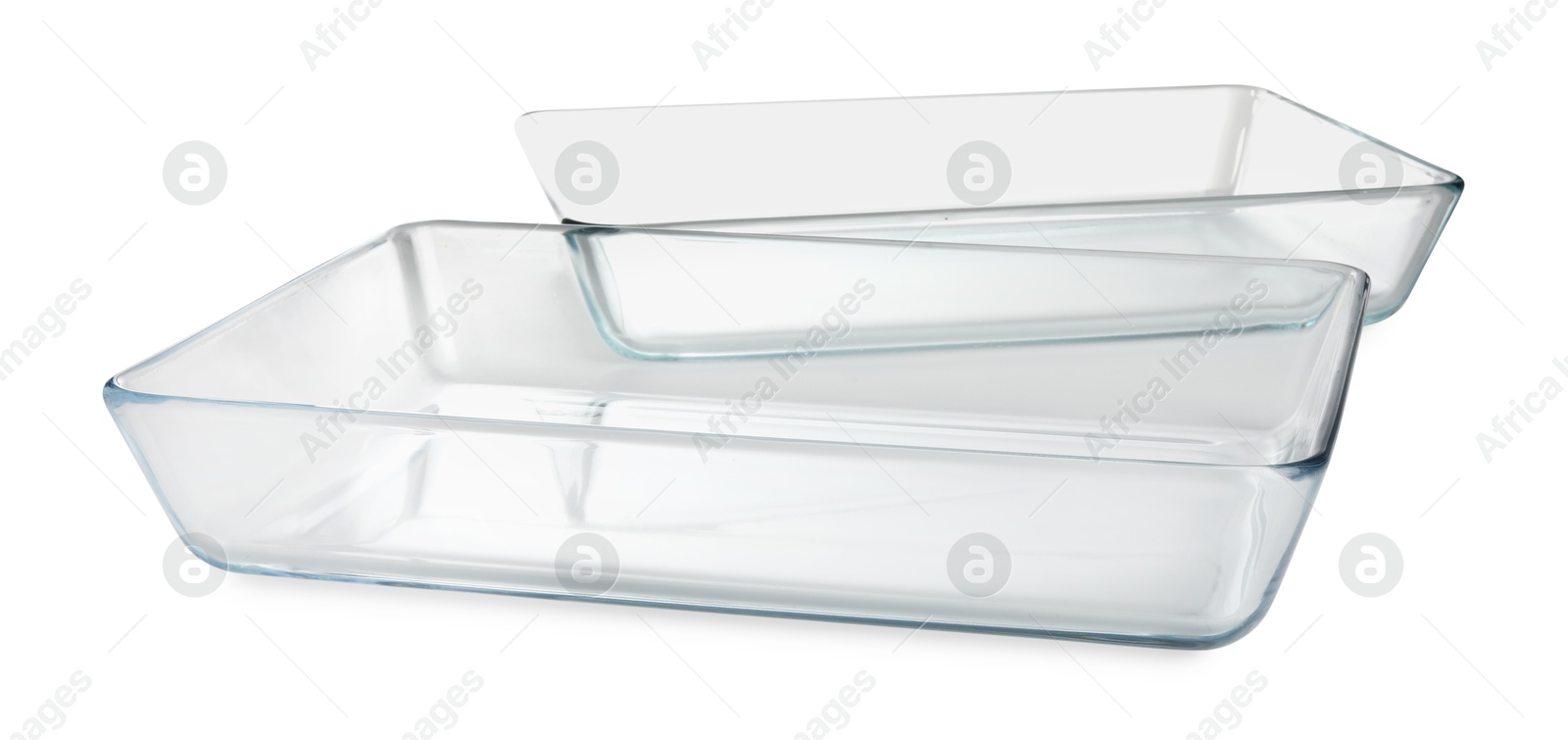 Photo of Two glass casseroles isolated on white. Cooking utensil