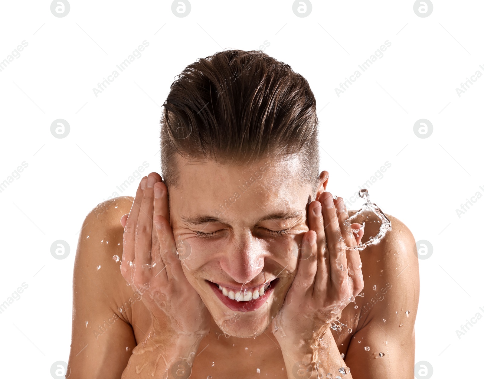 Photo of Smiling man washing his face on white background