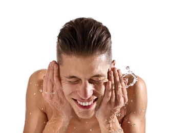 Photo of Smiling man washing his face on white background