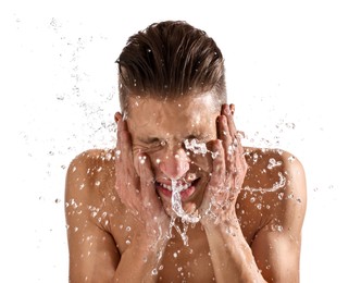 Photo of Smiling man washing his face on white background