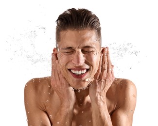 Photo of Smiling man washing his face on white background