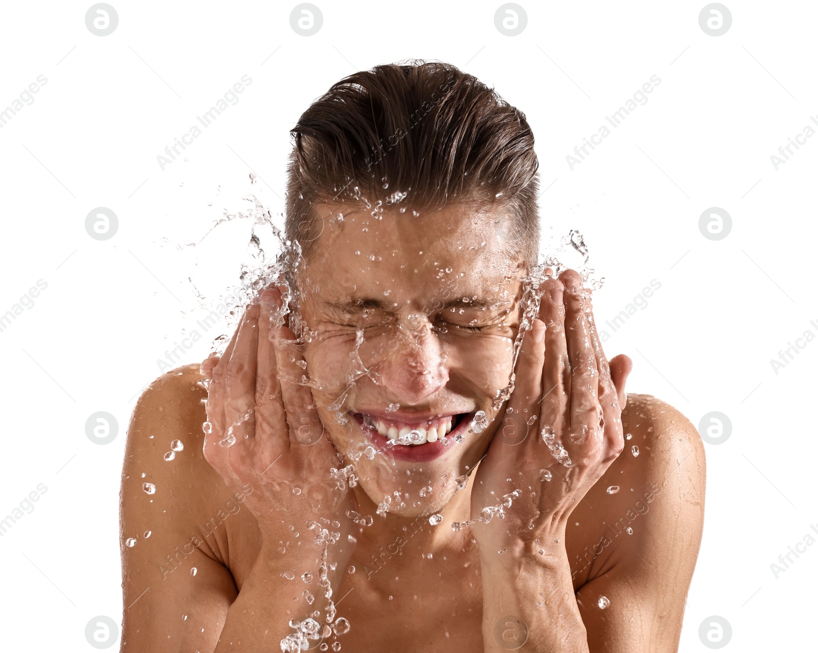 Photo of Smiling man washing his face on white background