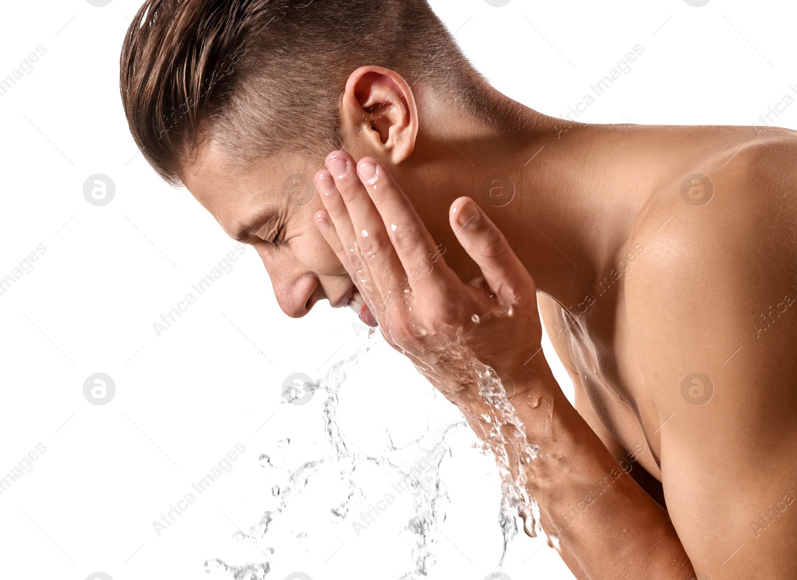 Photo of Smiling man washing his face on white background