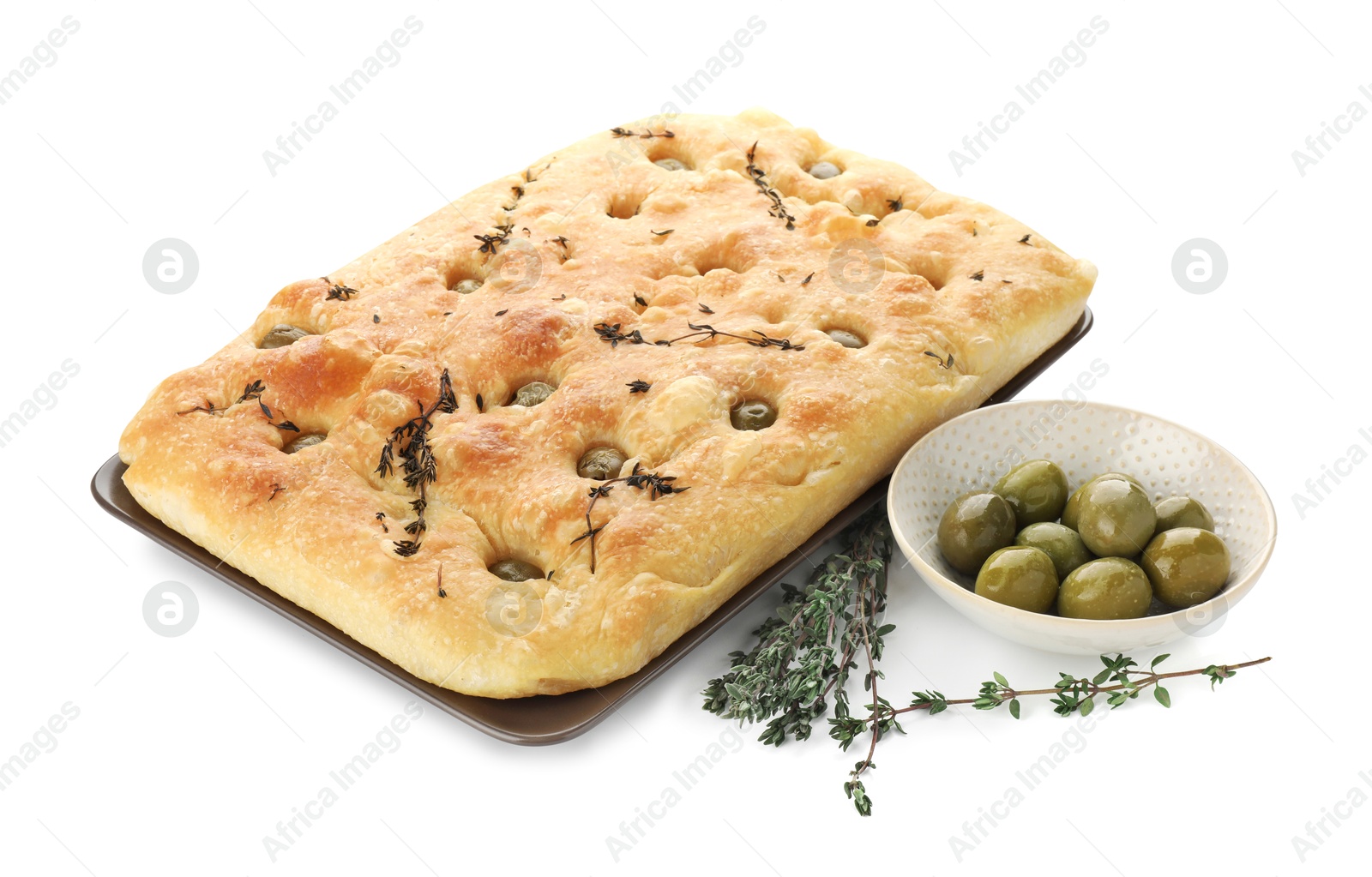 Photo of Delicious focaccia bread with olives and thyme isolated on white