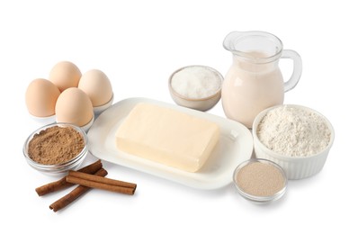 Photo of Making cinnamon rolls. Different ingredients for dough isolated on white